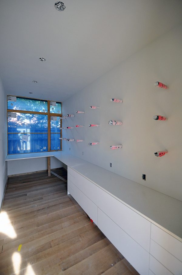 the office ready to instal the floating shelves